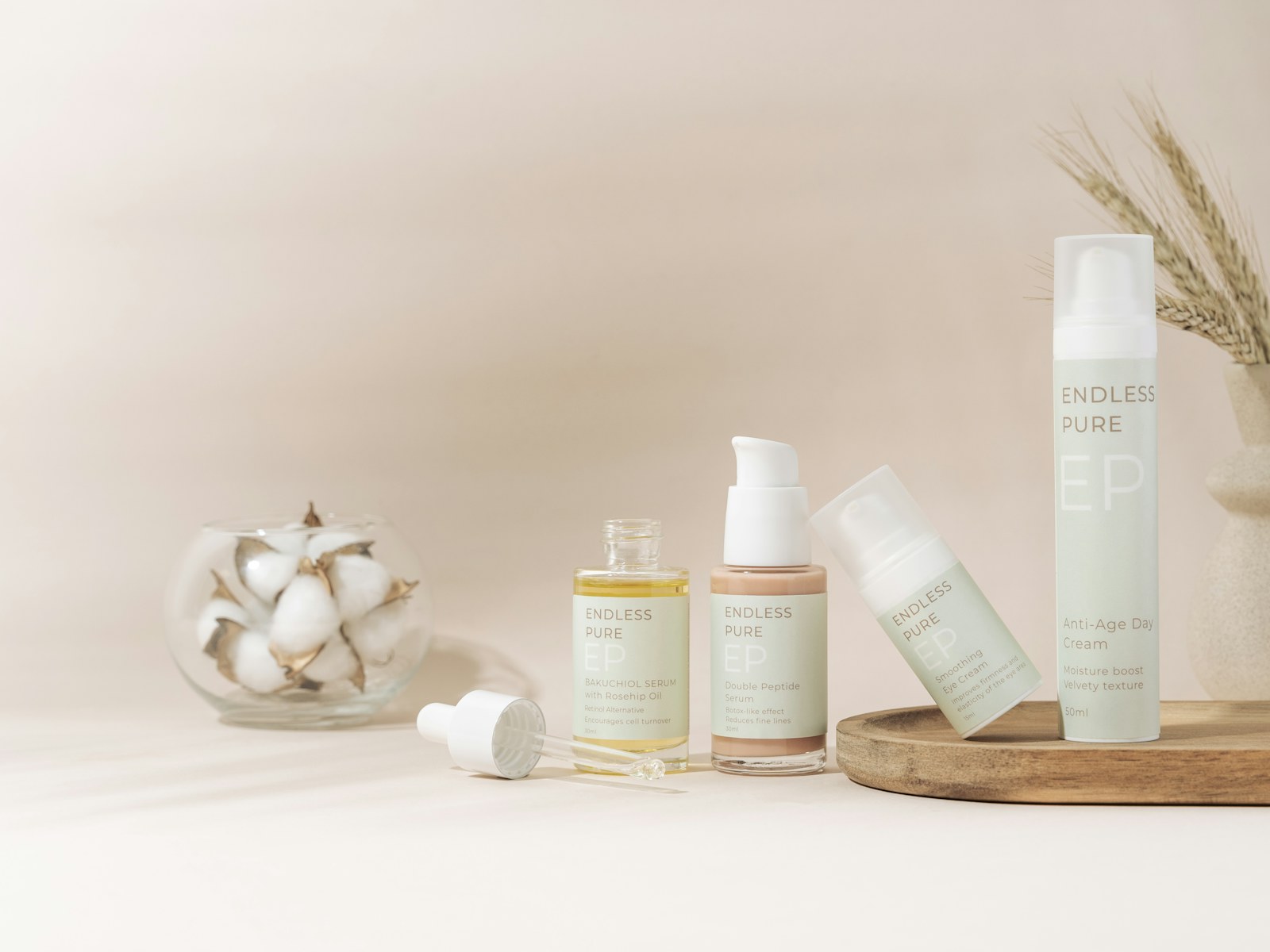 Elegant skincare products arranged on a tray against a soft beige backdrop